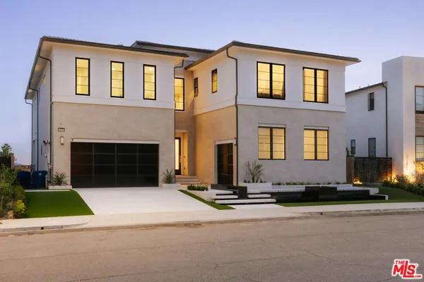 a front view of a house with yard