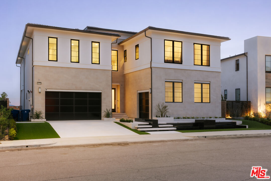 11773 Greenwood Drive Porter Ranch, CA 91326 - Photo 1 of 20 a front view of a house with yard