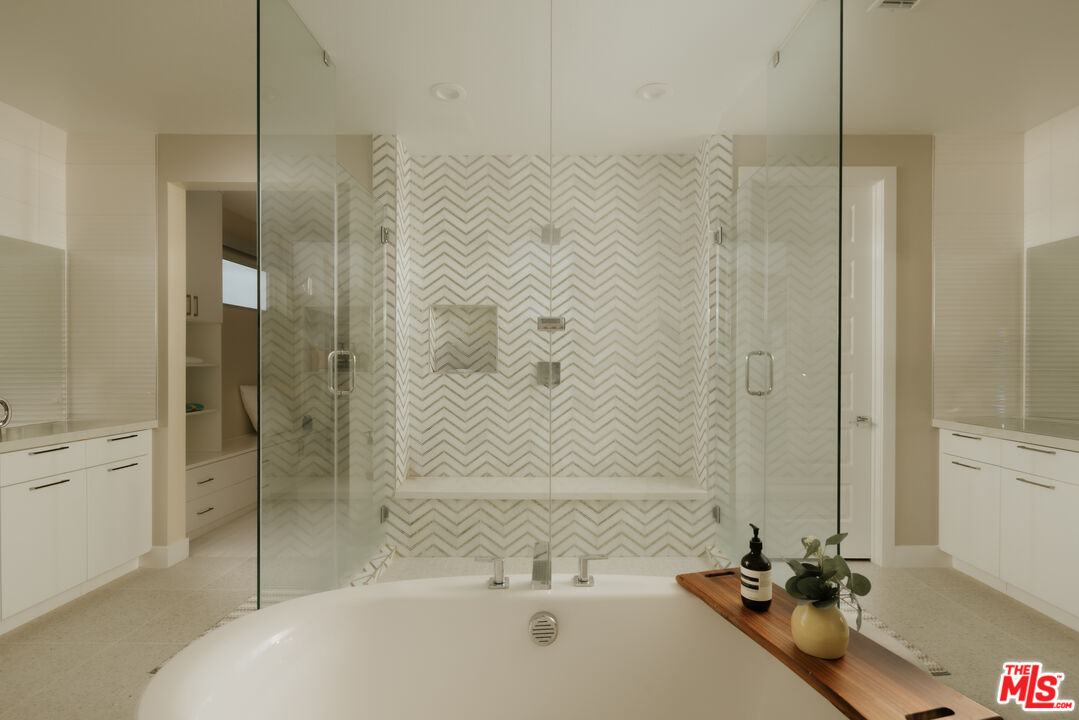 11773 Greenwood Drive Porter Ranch, CA 91326 - Photo 12 of 20 a bathroom with a tub a sink and shower