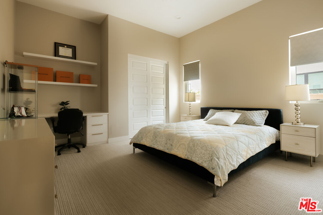 11773 Greenwood Drive Porter Ranch, CA 91326 - Photo 15 of 20 a bedroom with a bed chair and a window