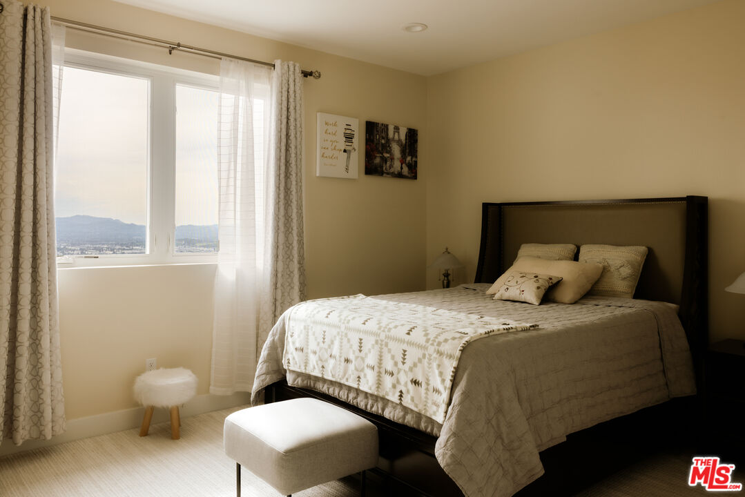 11773 Greenwood Drive Porter Ranch, CA 91326 - Photo 17 of 20 a bedroom with a bed and a window