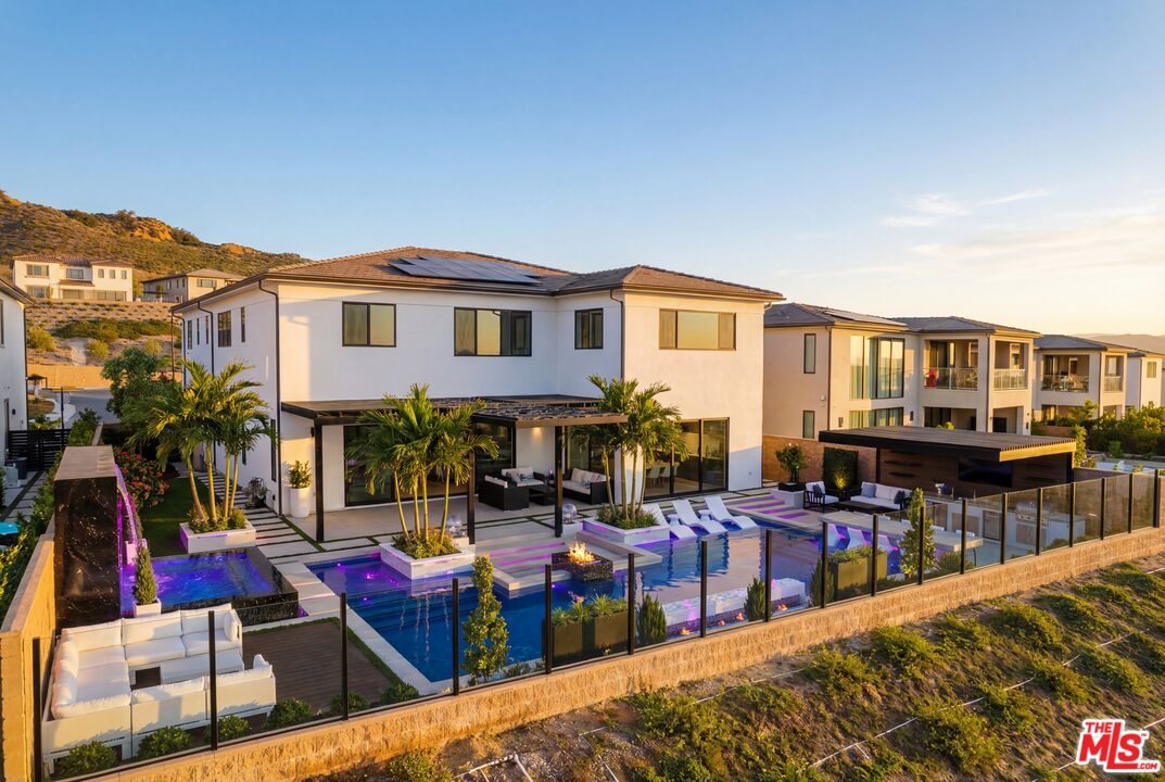 11773 Greenwood Drive Porter Ranch, CA 91326 - Photo 2 of 20 a view of a house with swimming pool