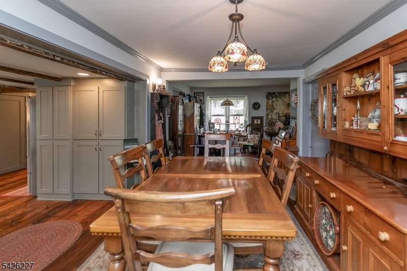 36 Main Street Flanders, NJ 07836 - Photo 7 of 49 a view of a dining room with furniture a chandelier and wooden floor