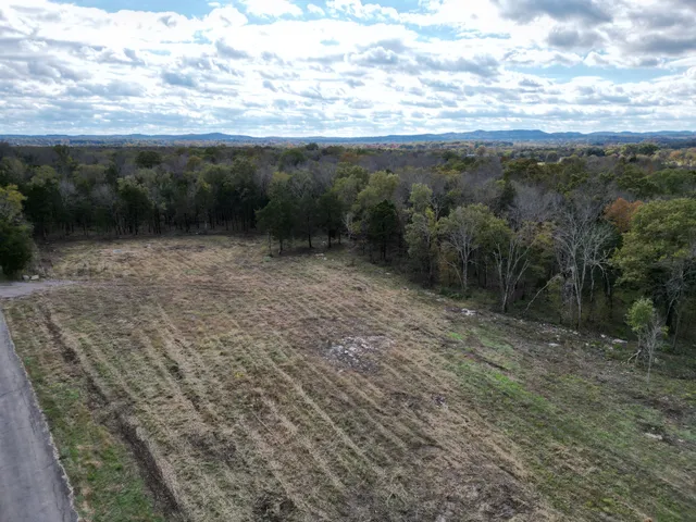 a view of a yard with an outdoor space