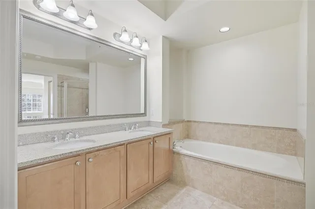 a bathroom with a shower and a sink