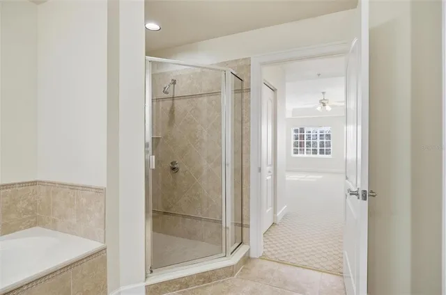 wooden floor in an empty room with a bathroom