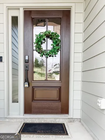 a view of a door and a window
