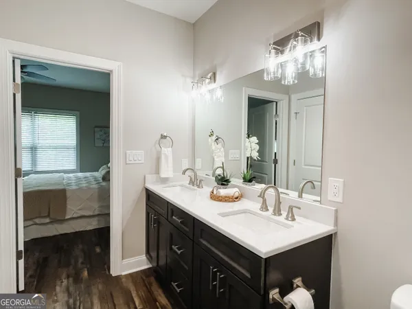 a bathroom with a sink double vanity and a mirror