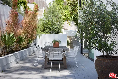 a view of a table and chairs in the patio