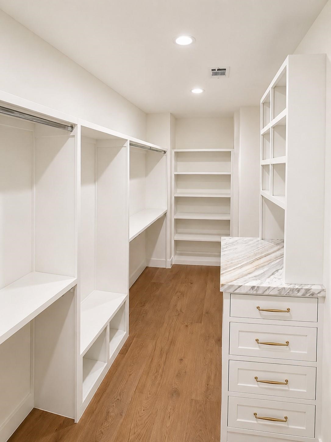 2325 Wroxton Road Houston, TX 77005 - Photo 24 of 34 Walk in closet with marble toped storage island