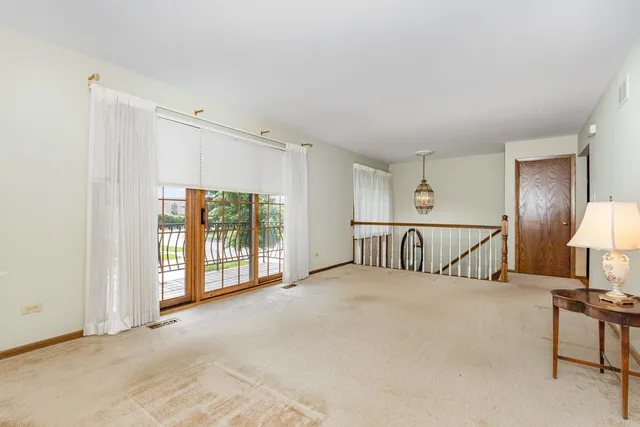a view of a livingroom with furniture and a window