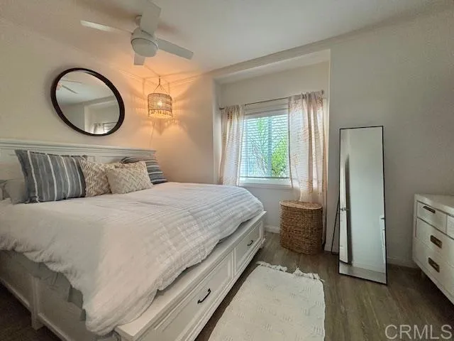 699 North Vulcan Avenue, Unit 80 Encinitas, CA 92024 - Photo 18 of 27 a bedroom with a bed and a dresser