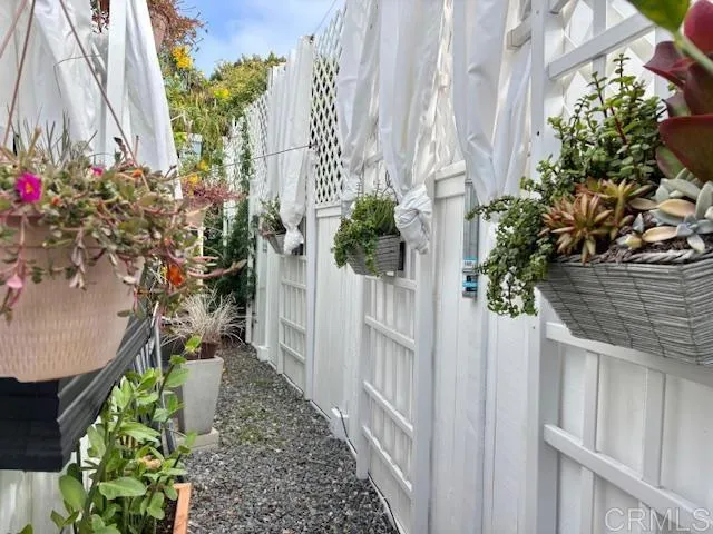 699 North Vulcan Avenue, Unit 80 Encinitas, CA 92024 - Photo 24 of 27 a house with flowers in front of it