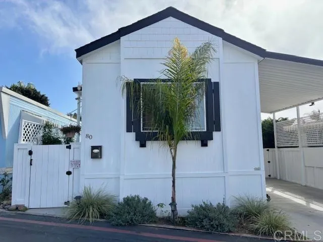 699 North Vulcan Avenue, Unit 80 Encinitas, CA 92024 - Photo 3 of 27 a front view of a house with garden