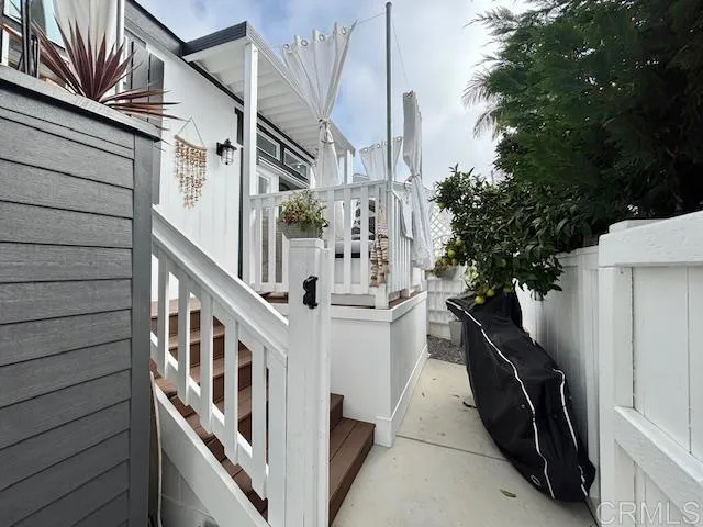 699 North Vulcan Avenue, Unit 80 Encinitas, CA 92024 - Photo 4 of 27 a view of a house with backyard and deck