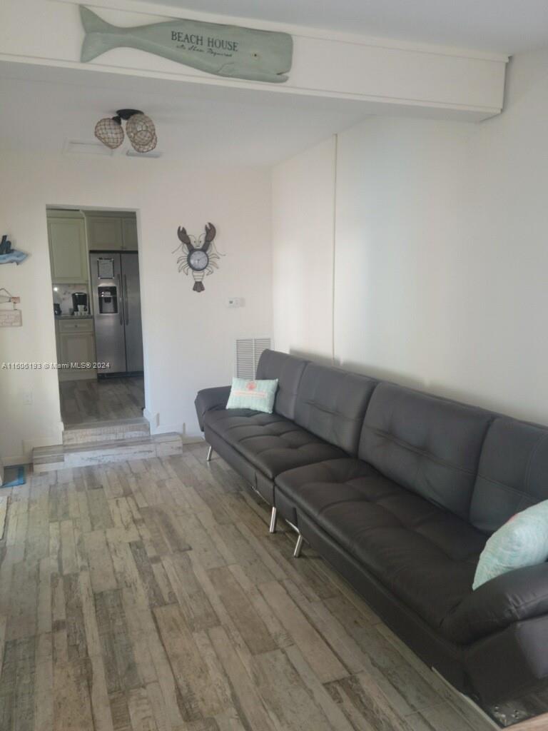 3201 Canal Drive, Unit 2 Pompano Beach, FL 33062 - Photo 5 of 12 a living room with furniture and a rug