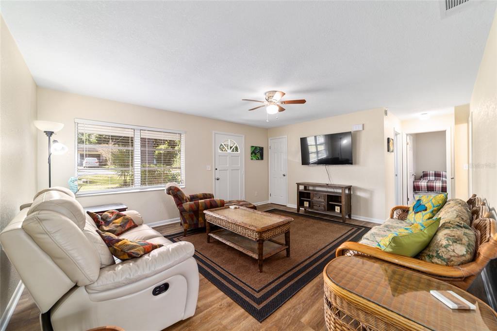 21529 Southwest Honeysuckle Street Dunnellon, FL 34431 - Photo 15 of 55 a living room with furniture and a flat screen tv