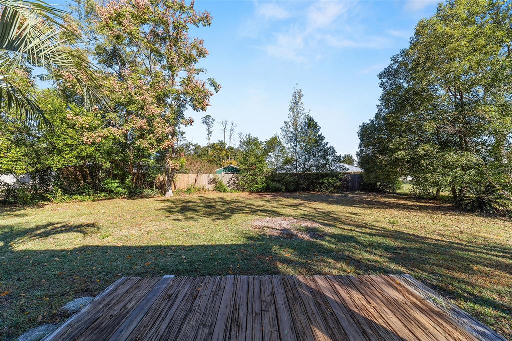 21529 Southwest Honeysuckle Street Dunnellon, FL 34431 - Photo 31 of 55 a view of a yard from a balcony