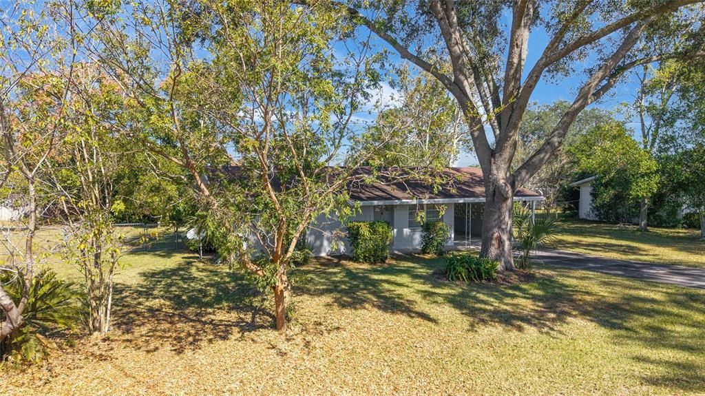 21529 Southwest Honeysuckle Street Dunnellon, FL 34431 - Photo 40 of 55 a view of a house with a yard