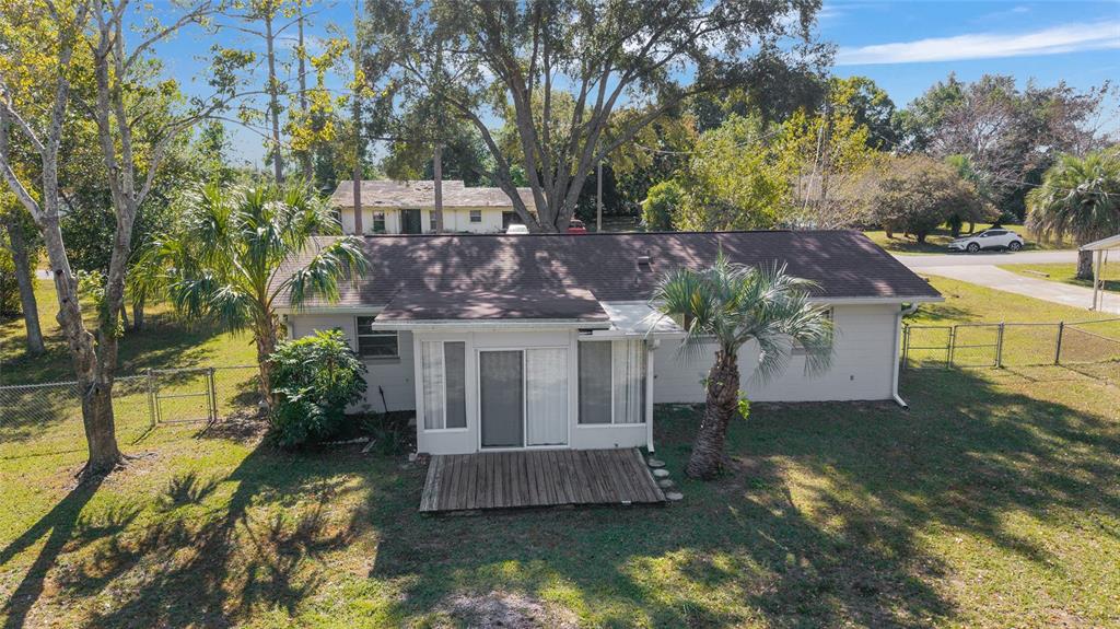 21529 Southwest Honeysuckle Street Dunnellon, FL 34431 - Photo 46 of 55 a view of house with a yard and a large tree