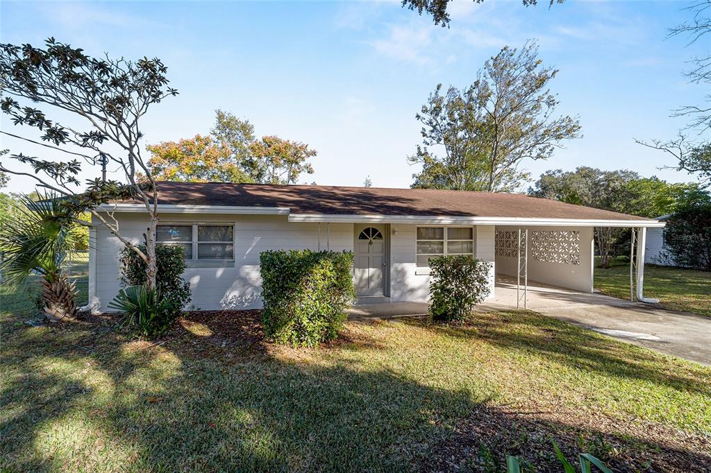 21529 Southwest Honeysuckle Street Dunnellon, FL 34431 - Photo 8 of 55 front view of a house with a yard