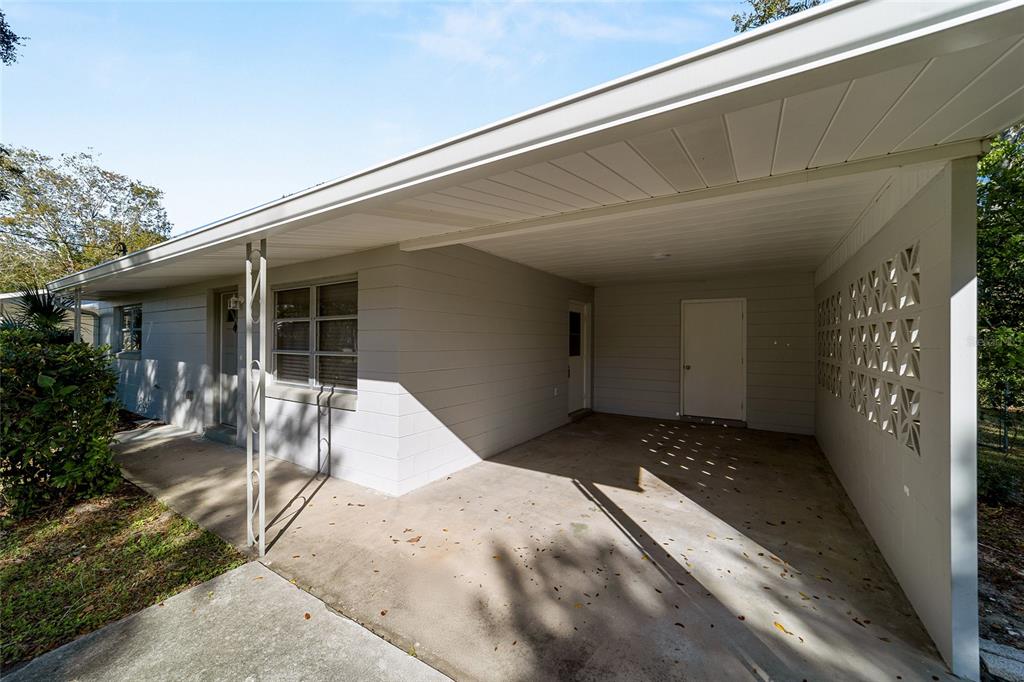 21529 Southwest Honeysuckle Street Dunnellon, FL 34431 - Photo 9 of 55 a view of backyard with chair and potted plants