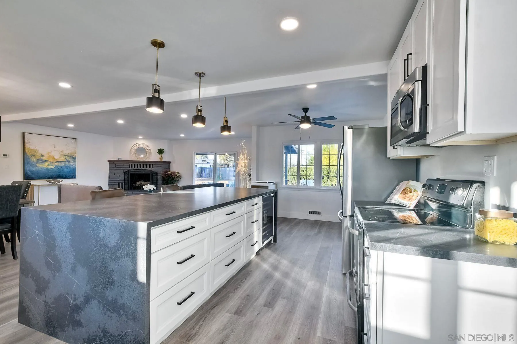 730 Montview Drive Escondido, CA 92025 - Photo 1 of 47 a kitchen with stainless steel appliances granite countertop a sink a stove and a wooden floors