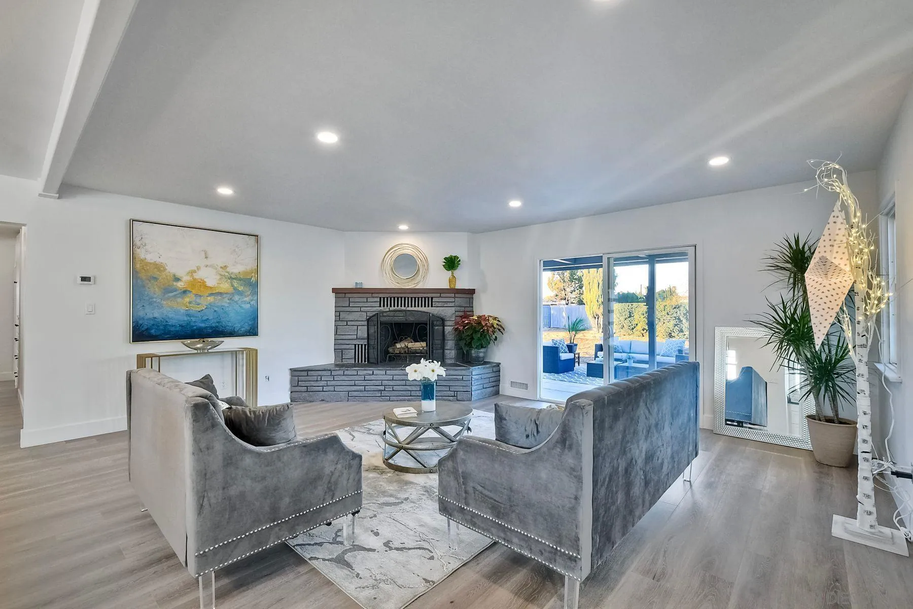 730 Montview Drive Escondido, CA 92025 - Photo 12 of 47 a living room with furniture a fireplace and a flat screen tv