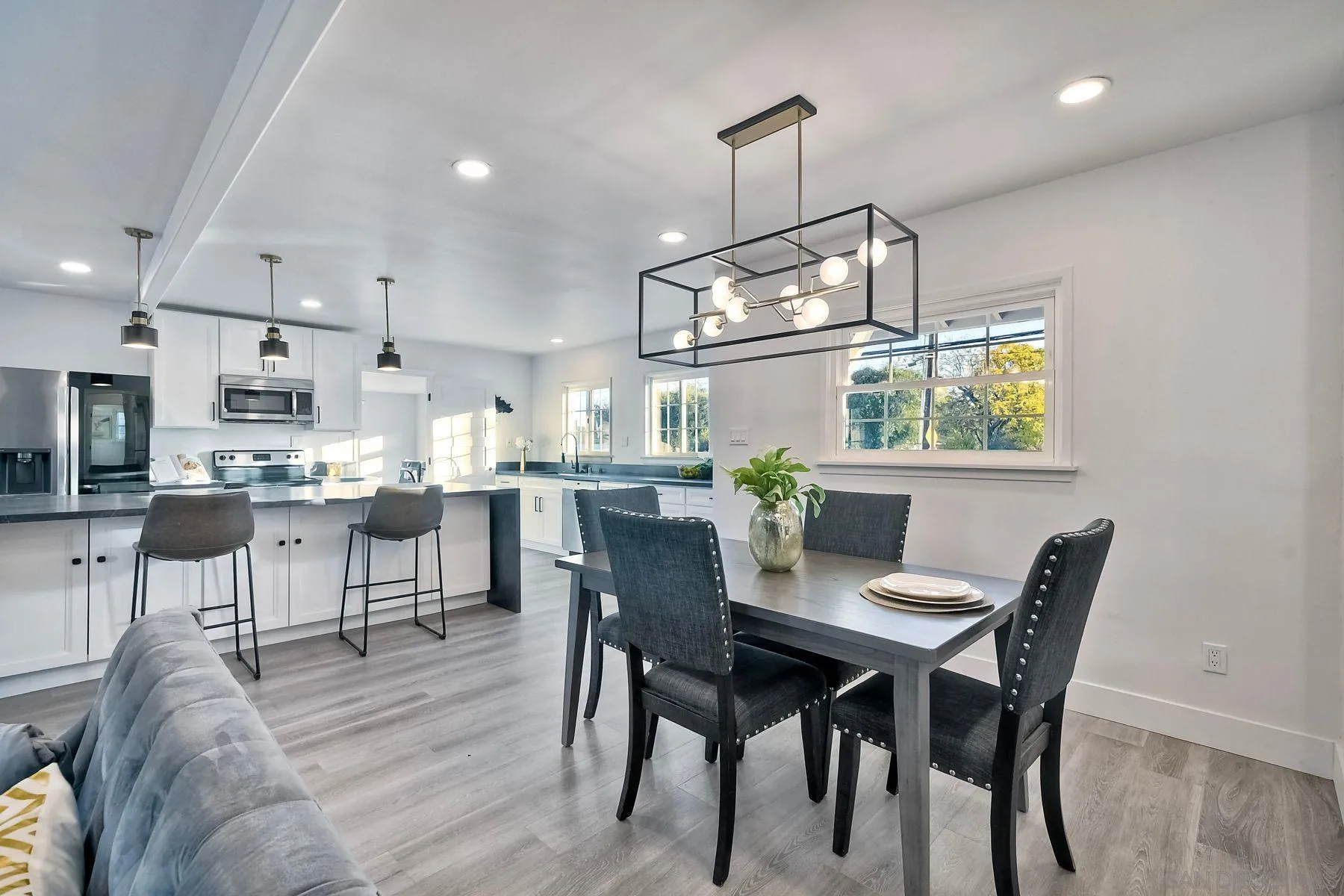 730 Montview Drive Escondido, CA 92025 - Photo 17 of 47 a view of a dining room with furniture a chandelier and wooden floor