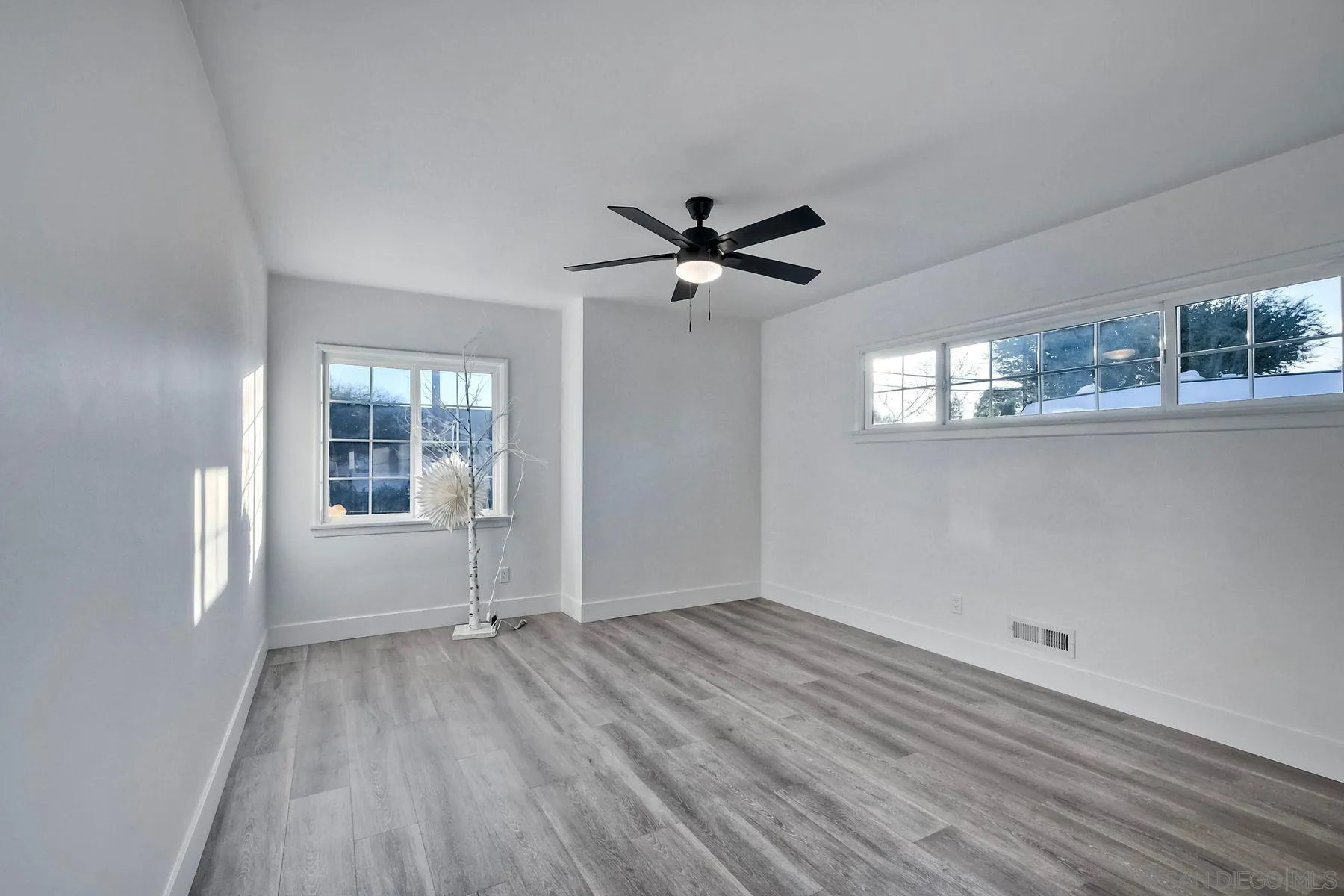 730 Montview Drive Escondido, CA 92025 - Photo 24 of 47 wooden floor in an empty room with a window