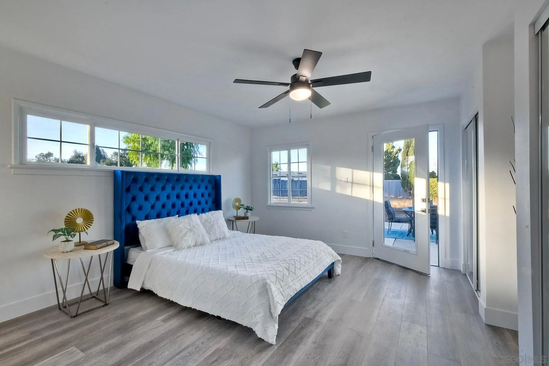 730 Montview Drive Escondido, CA 92025 - Photo 27 of 47 a bedroom with a bed and a chandelier