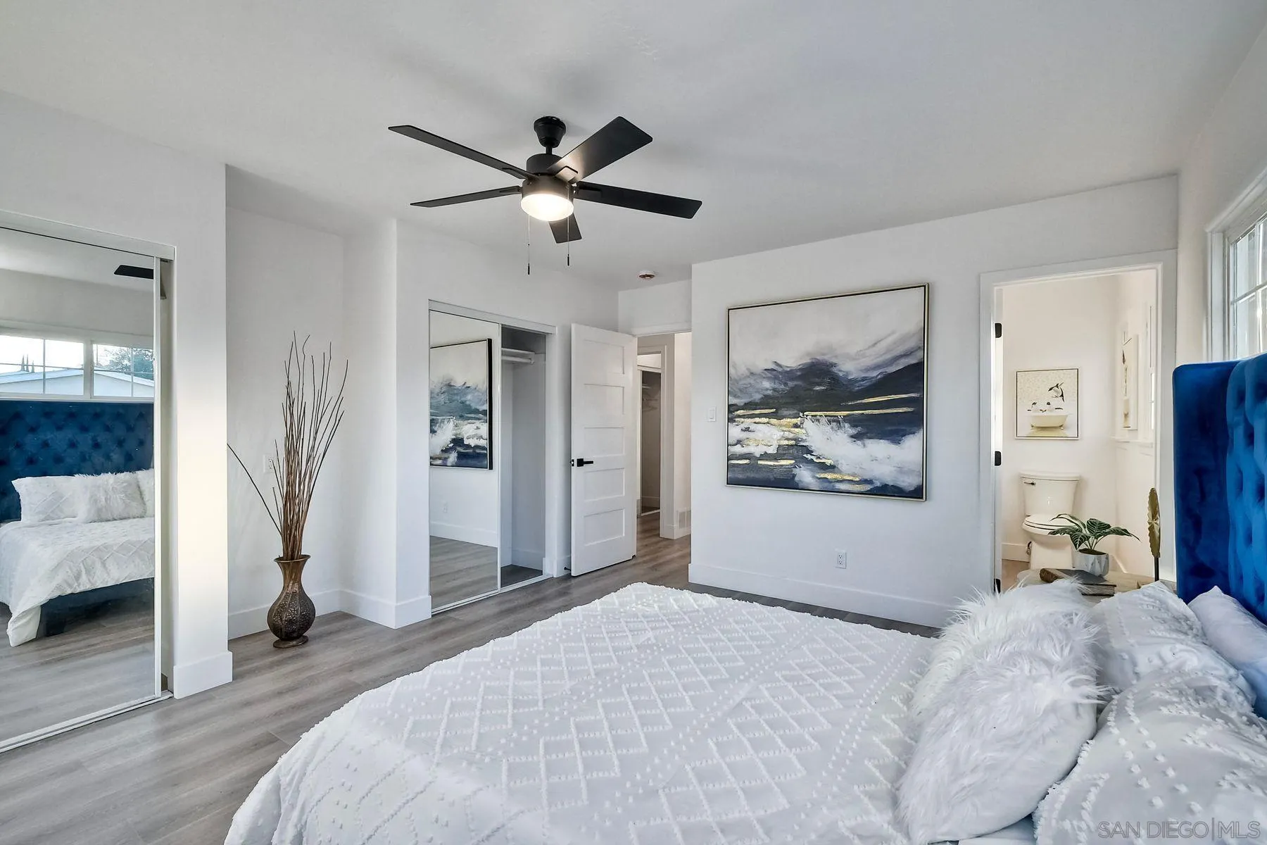 730 Montview Drive Escondido, CA 92025 - Photo 29 of 47 a bedroom with a large bed and a chandelier