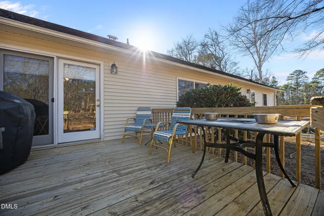 a view of a chair and table of the house