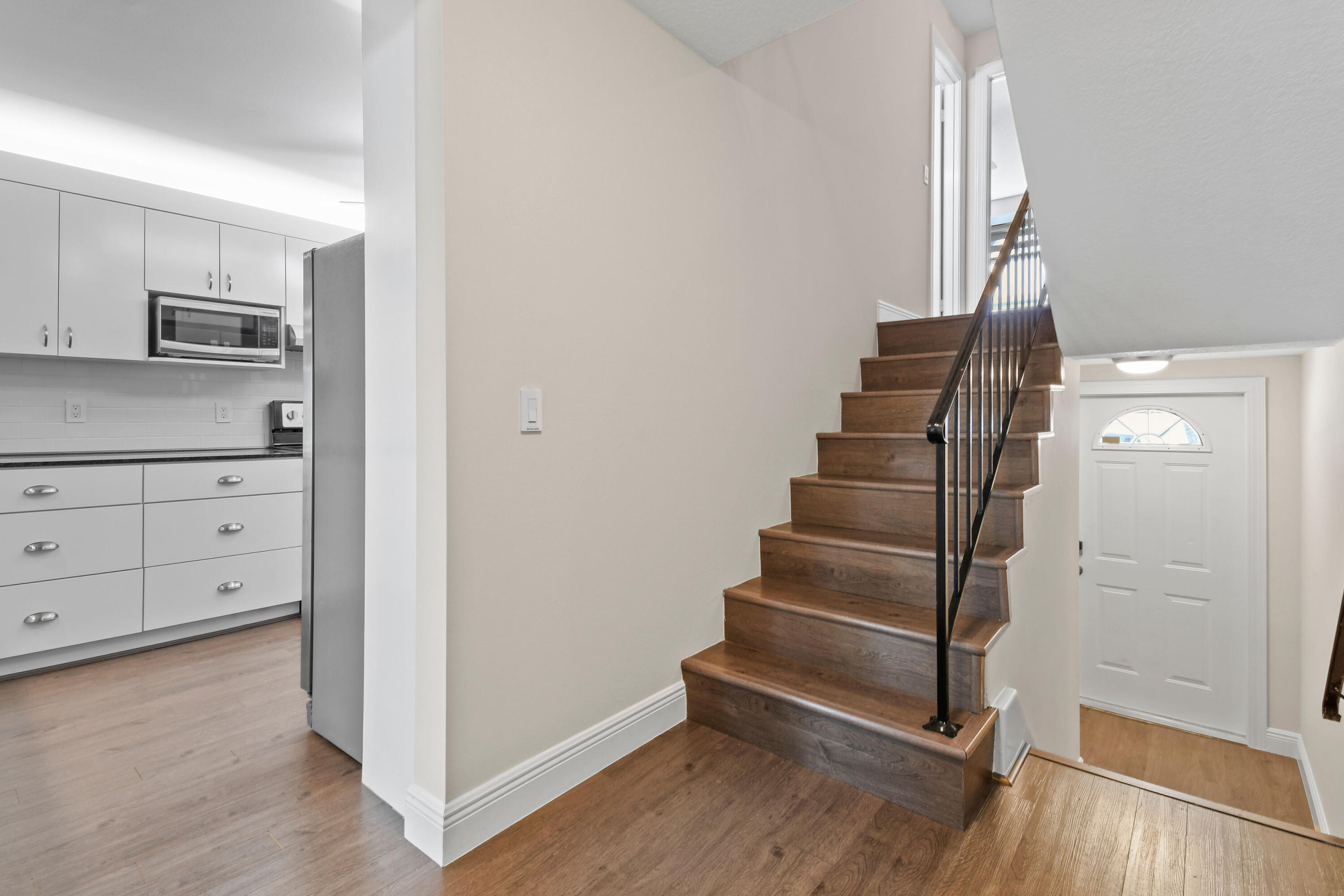 396 Golfview Road, Unit E North Palm Beach, FL 33408 - Photo 12 of 45 a view of an entryway with wooden floor