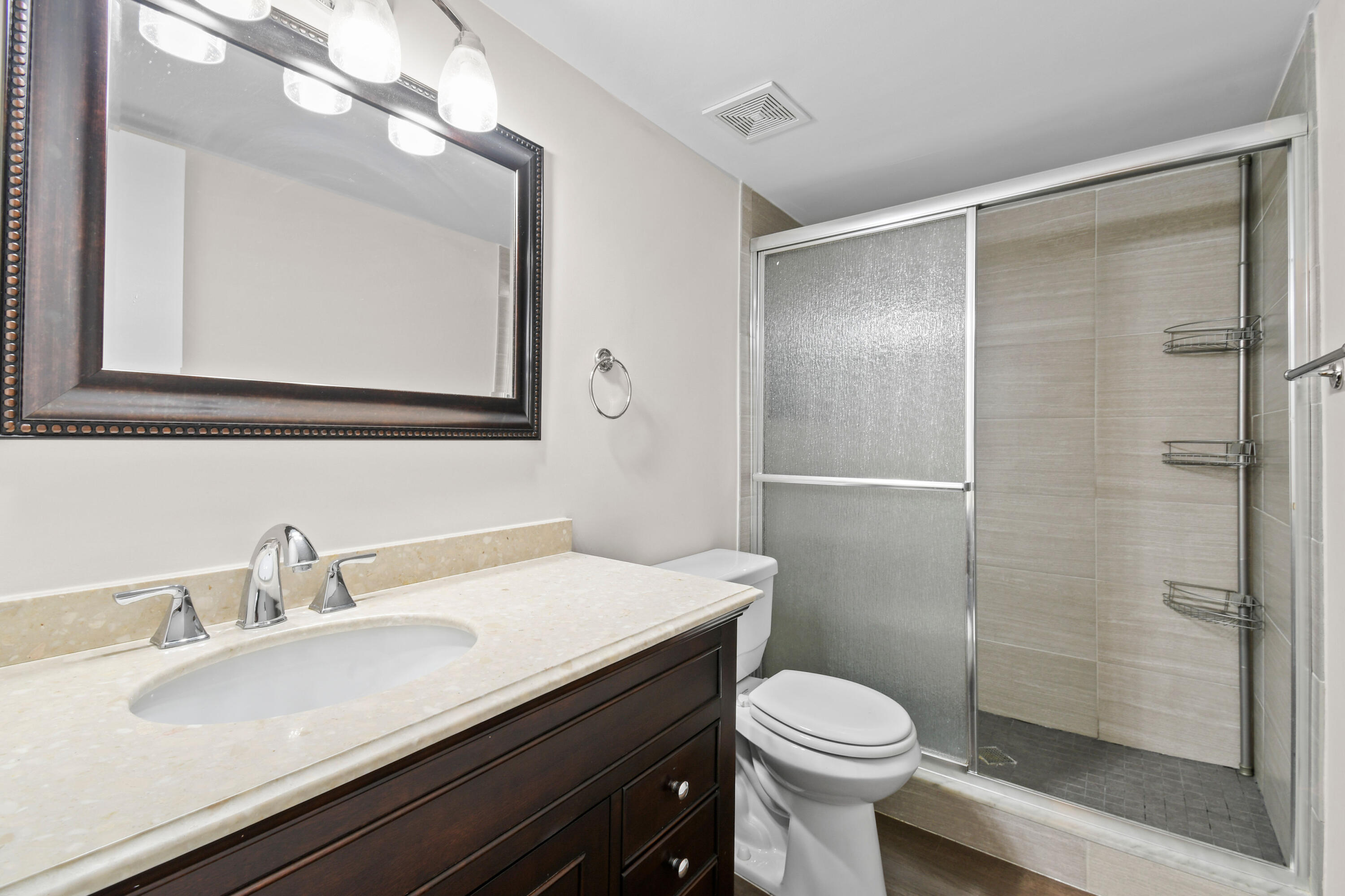 396 Golfview Road, Unit E North Palm Beach, FL 33408 - Photo 14 of 45 a bathroom with a sink toilet and shower