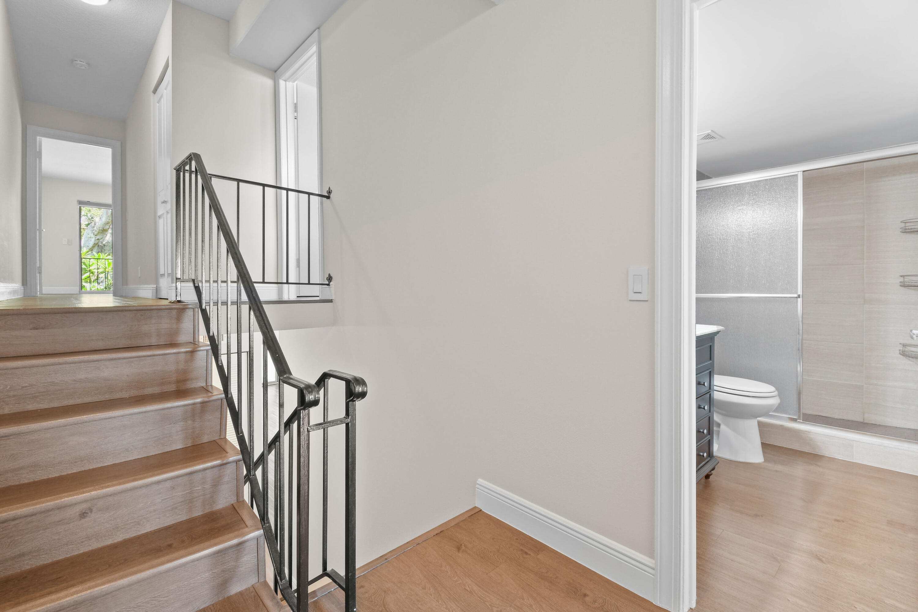 396 Golfview Road, Unit E North Palm Beach, FL 33408 - Photo 15 of 45 a view of a hallway with wooden floor and entryway