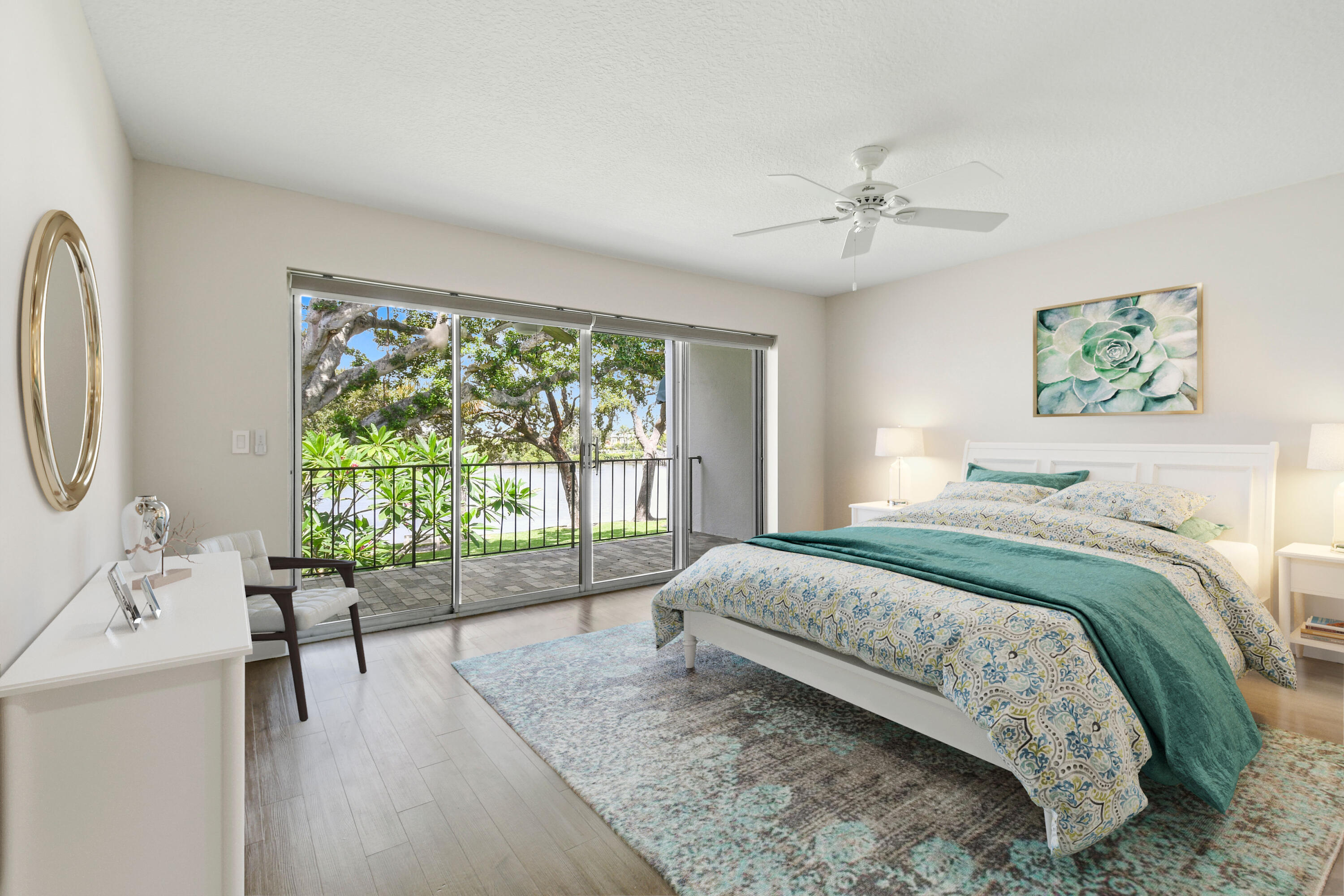 396 Golfview Road, Unit E North Palm Beach, FL 33408 - Photo 16 of 45 a bedroom with a bed and a large window