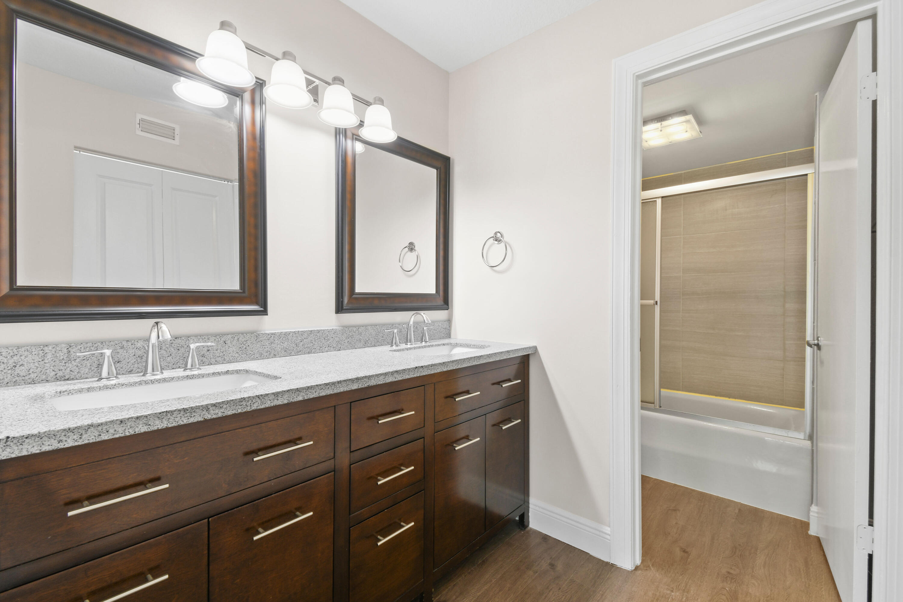 396 Golfview Road, Unit E North Palm Beach, FL 33408 - Photo 19 of 45 a bathroom with a granite countertop sink mirror and a