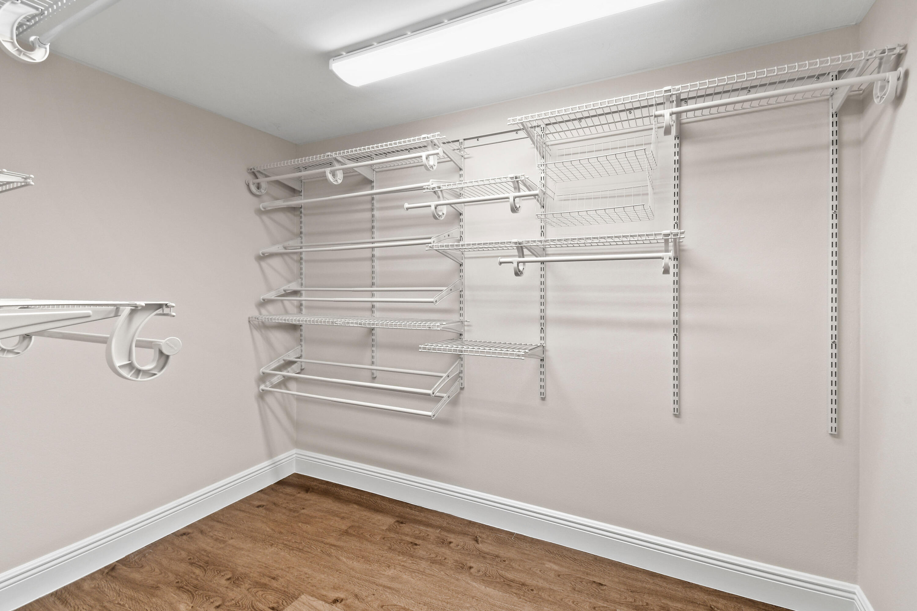 396 Golfview Road, Unit E North Palm Beach, FL 33408 - Photo 21 of 45 a view of walk in closet with empty racks