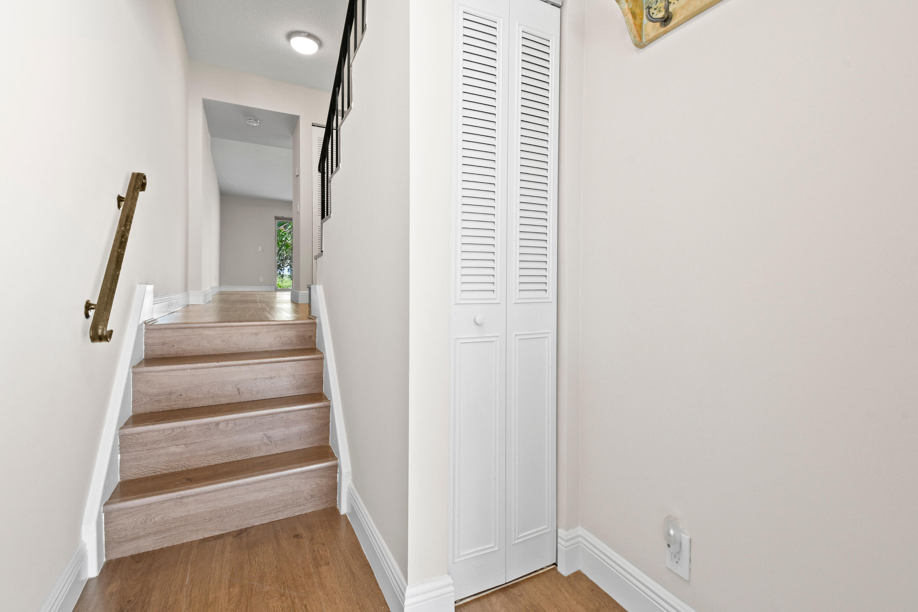 396 Golfview Road, Unit E North Palm Beach, FL 33408 - Photo 3 of 45 a view of entryway with wooden floor