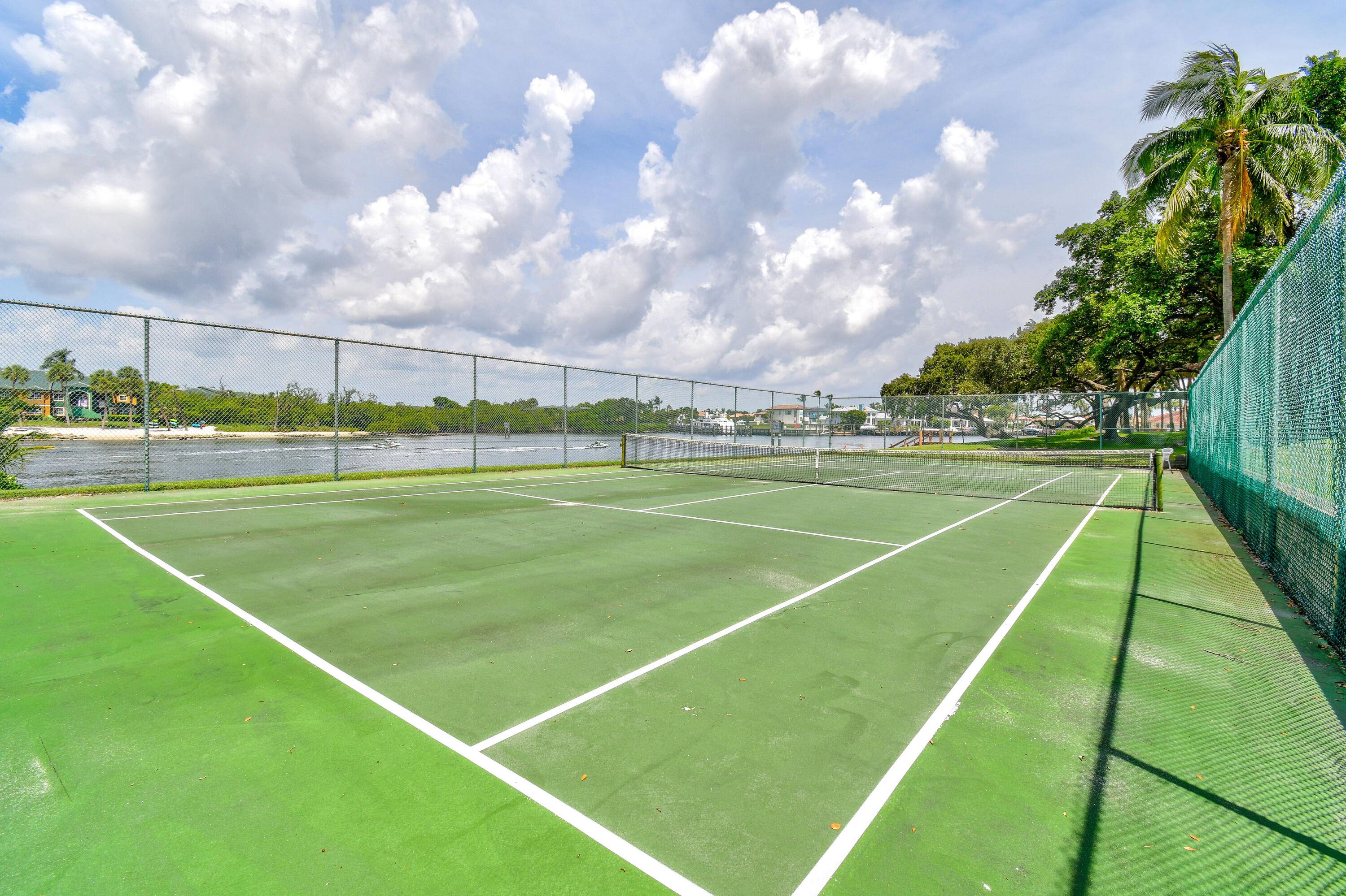 396 Golfview Road, Unit E North Palm Beach, FL 33408 - Photo 31 of 45 a view of an outdoor space and tennis court