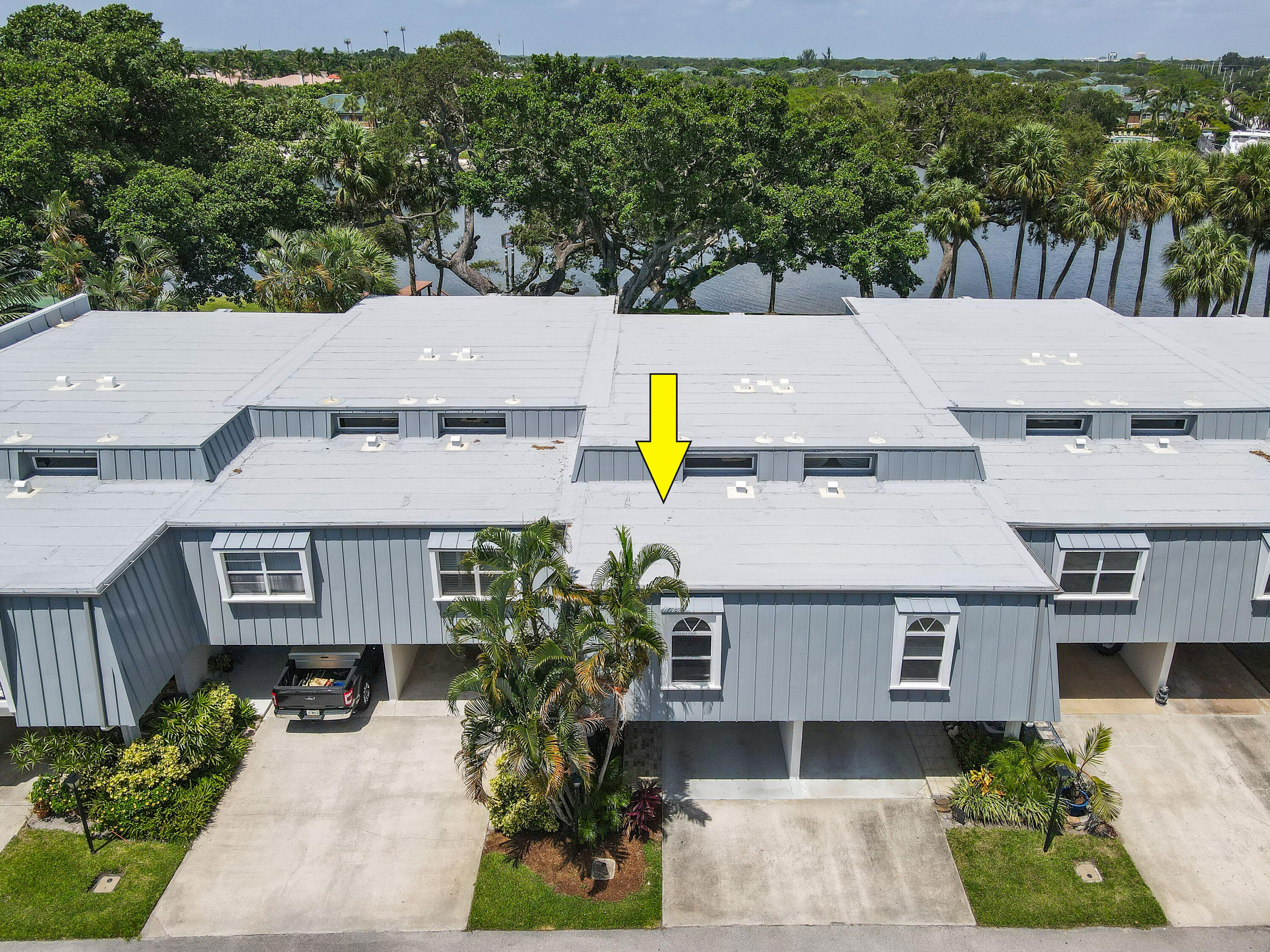396 Golfview Road, Unit E North Palm Beach, FL 33408 - Photo 33 of 45 an aerial view of a house with a garden and plants