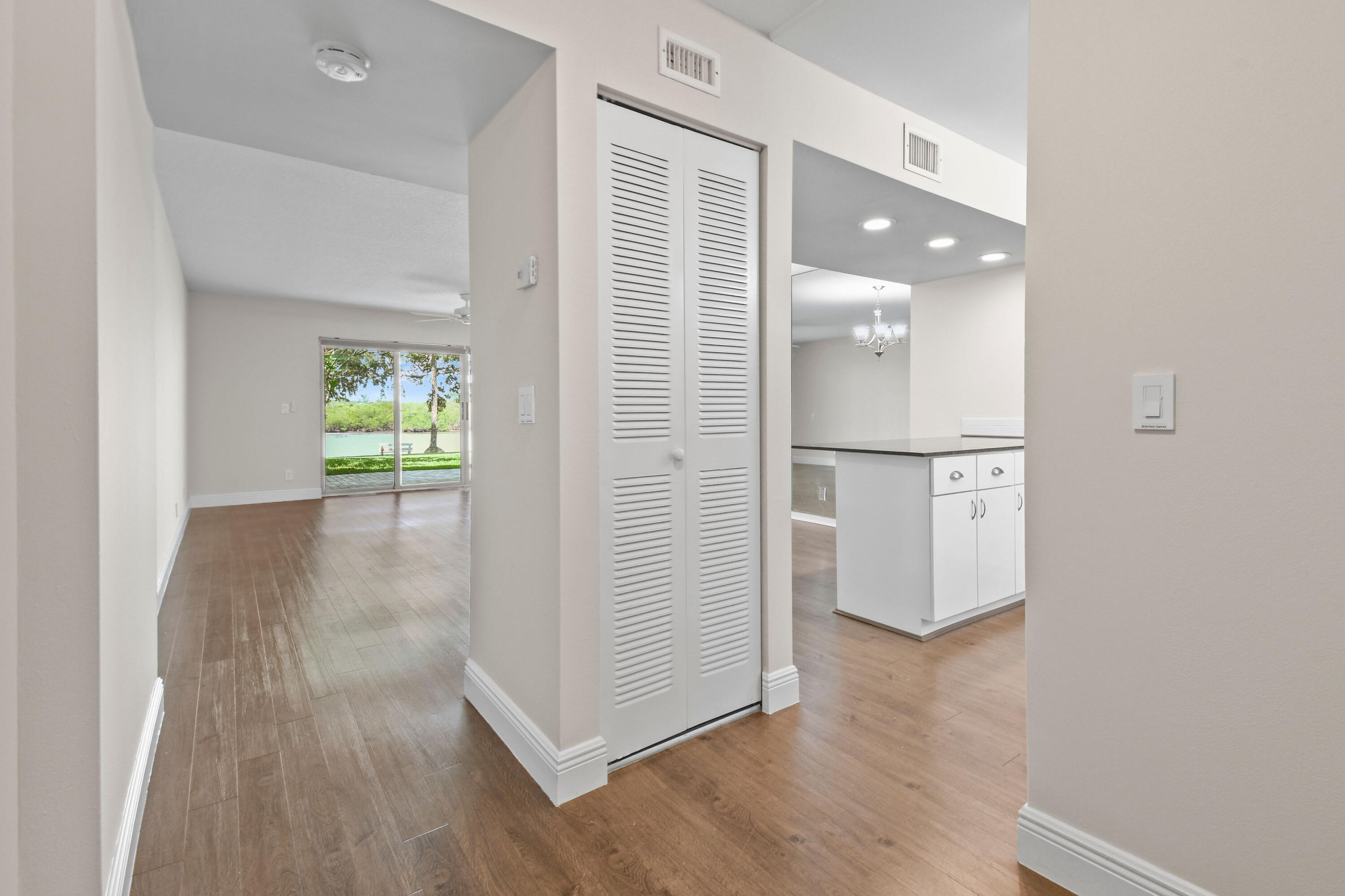 396 Golfview Road, Unit E North Palm Beach, FL 33408 - Photo 4 of 45 wooden floor in an empty room with a window