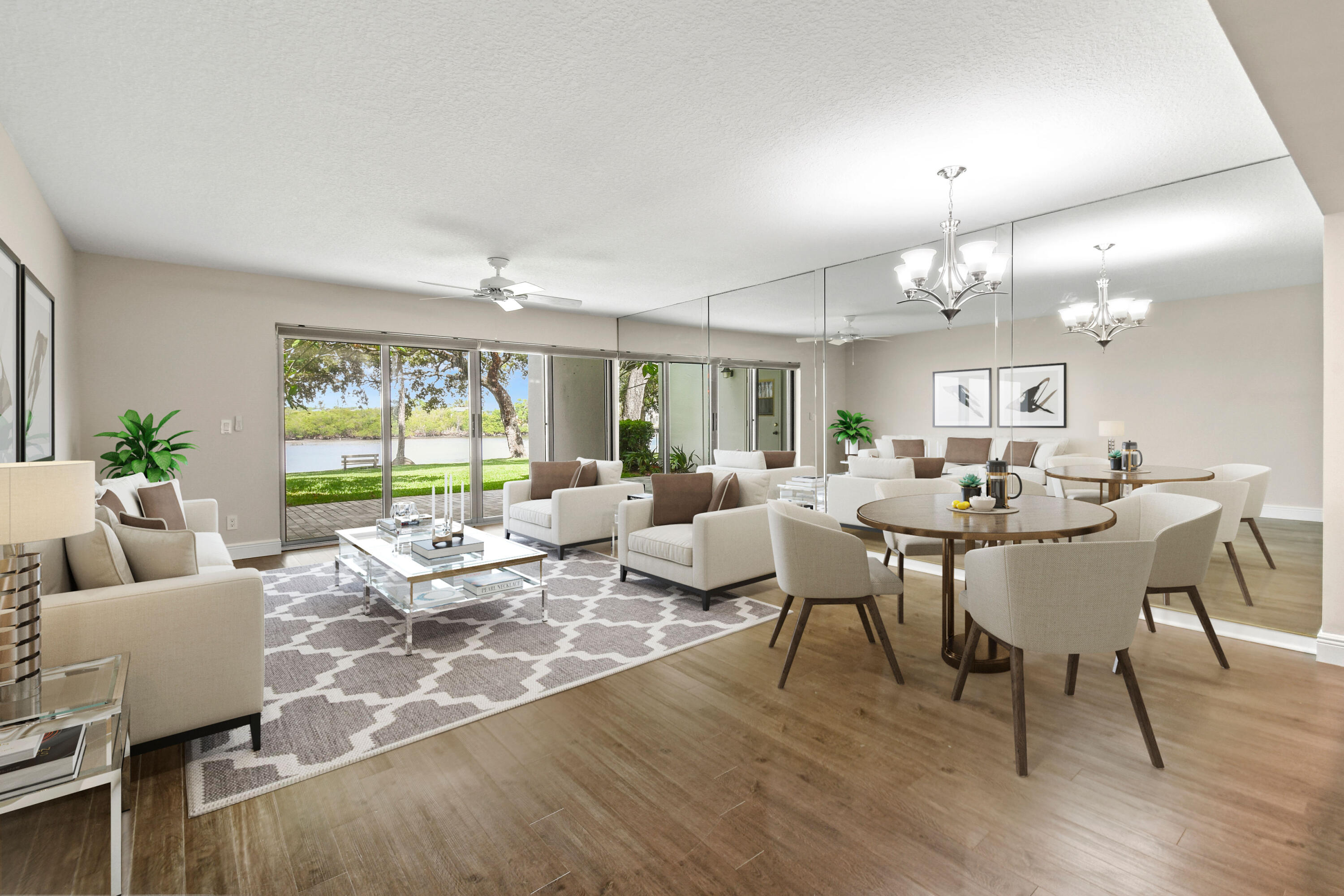396 Golfview Road, Unit E North Palm Beach, FL 33408 - Photo 5 of 45 a living room with lots of furniture and a large window