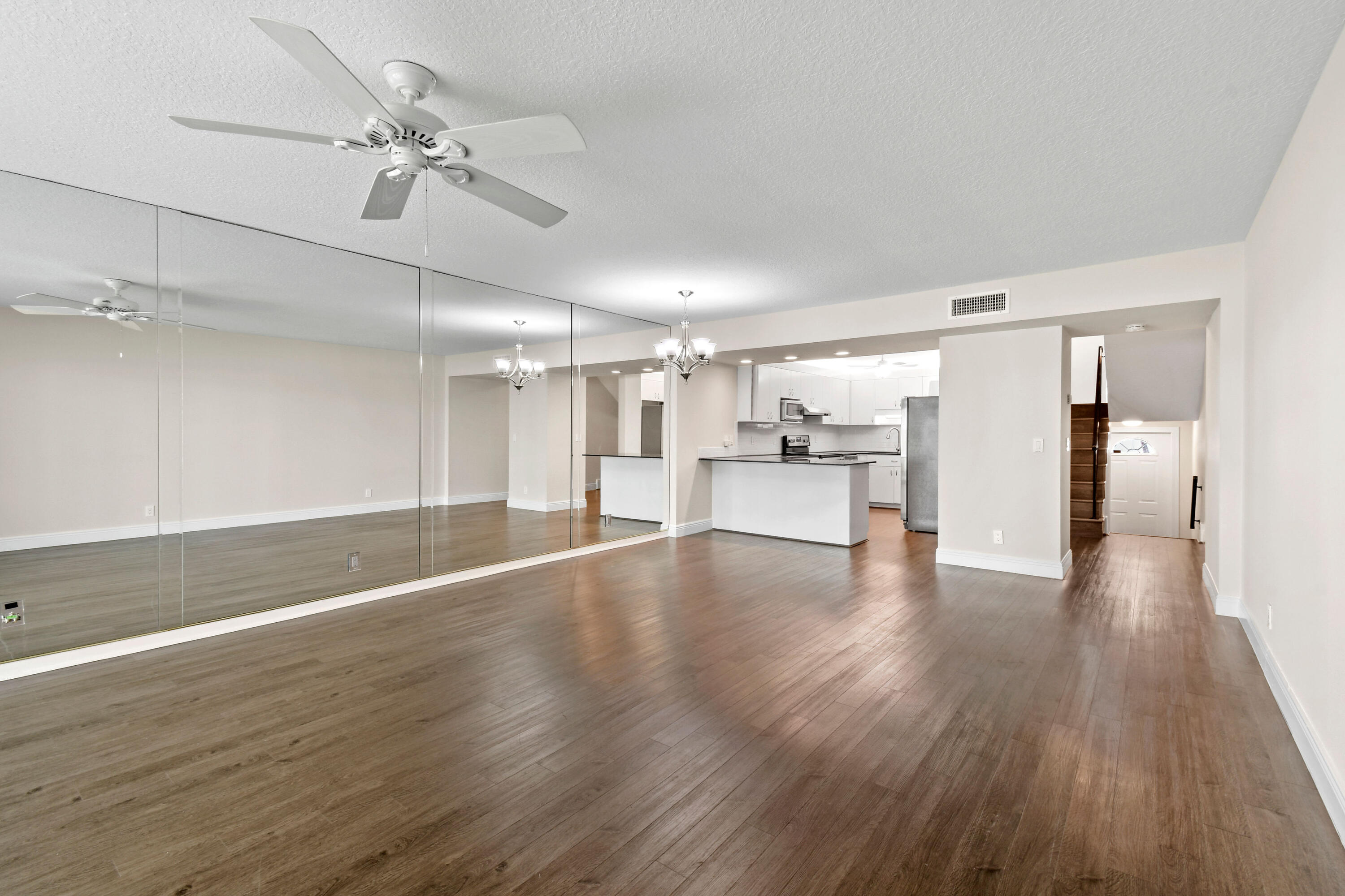 396 Golfview Road, Unit E North Palm Beach, FL 33408 - Photo 7 of 45 a view of empty room with wooden floor and window