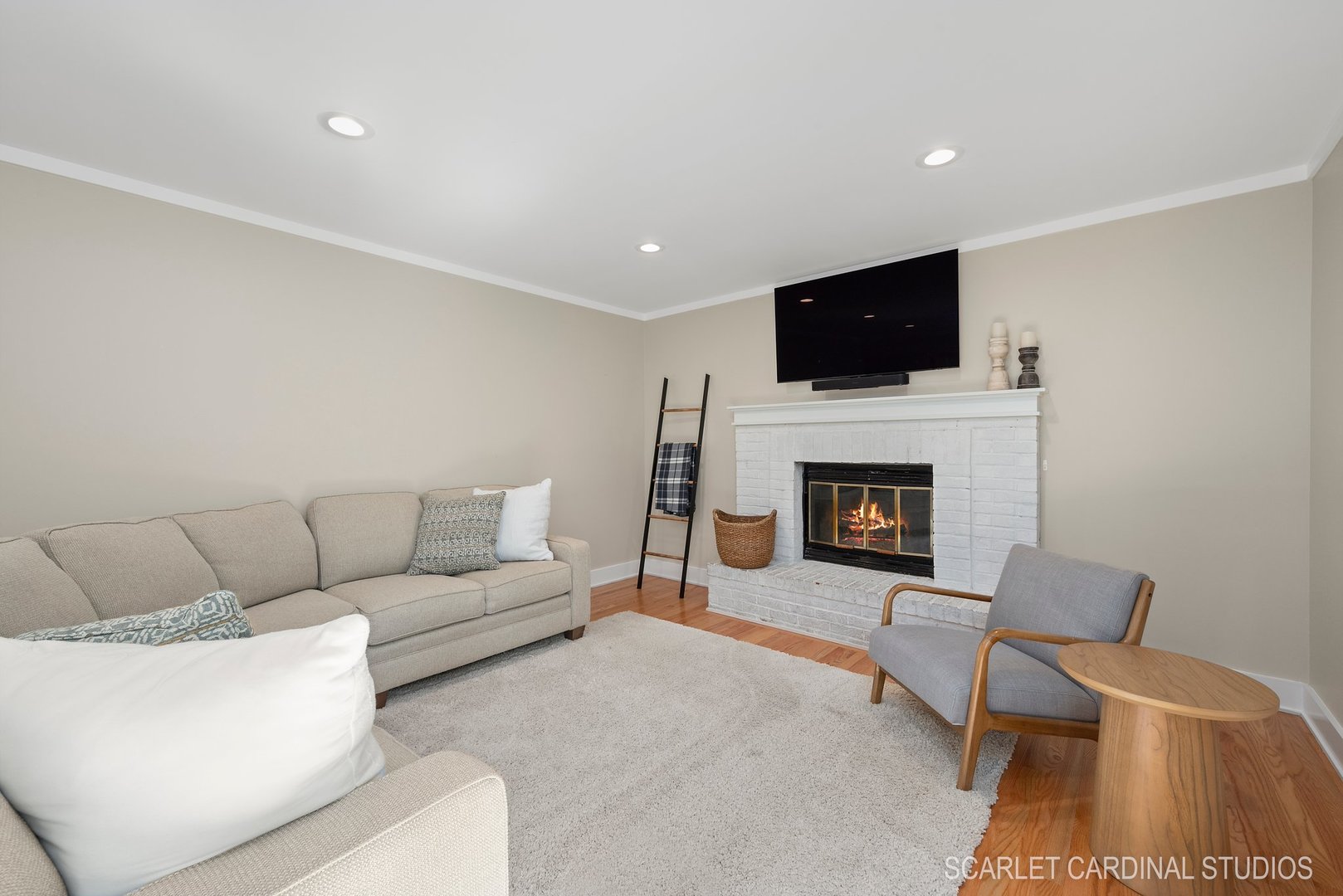 742 South River Road Naperville, IL 60540 - Photo 14 of 39 a living room with furniture a flat screen tv and a fireplace