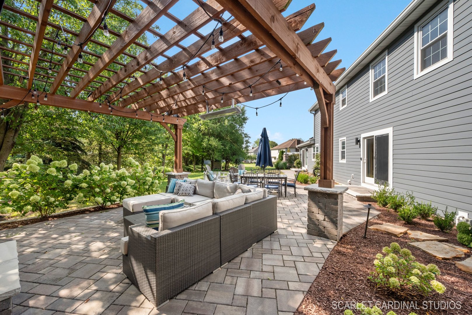742 South River Road Naperville, IL 60540 - Photo 3 of 39 a view of a patio with couches table and chairs and potted plants