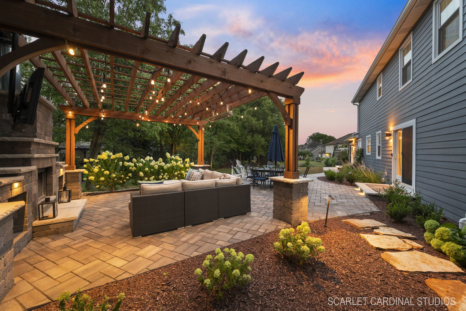 742 South River Road Naperville, IL 60540 - Photo 5 of 39 a view of a patio with couches chairs and a fire pit