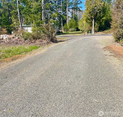 a view of a road with a building in the background