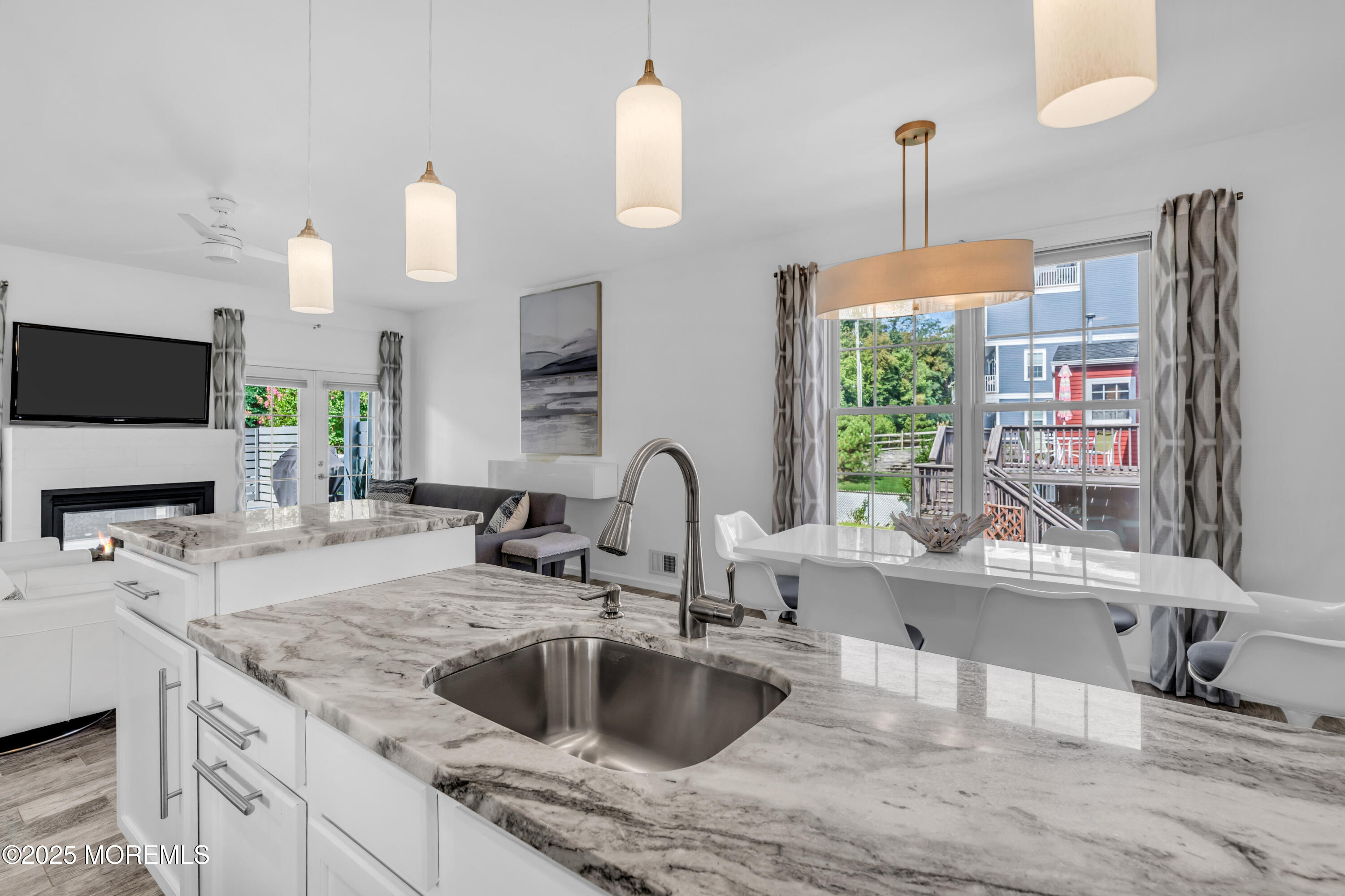 12 Locust Street Highlands, NJ 07732 - Photo 12 of 47 a kitchen with kitchen island granite countertop a sink a counter top space and cabinets